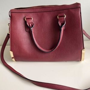 Burgundy satchel with crossbody strap